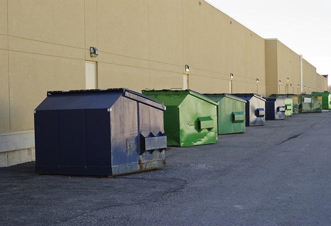 a row of large construction dumpsters on-site in Arpin, WI